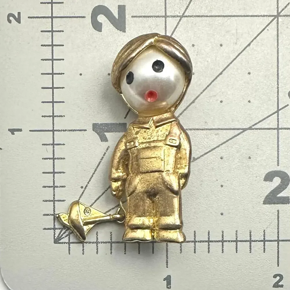 Vintage gold tone boy child with sailboat faux pearl articulated figural brooch